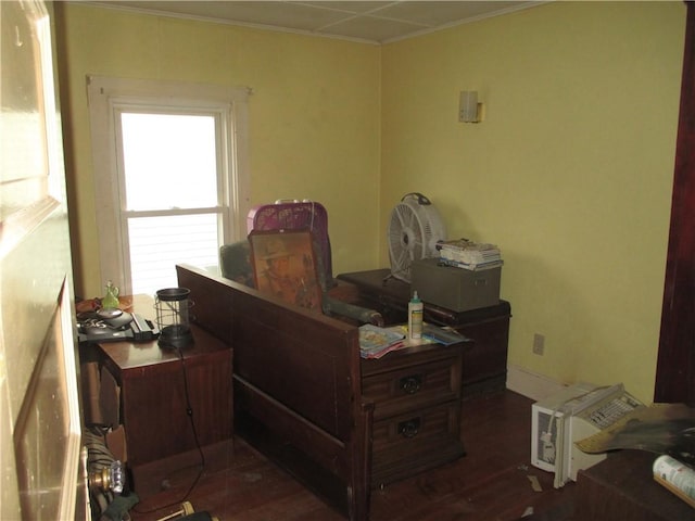 home office with dark wood finished floors and ornamental molding