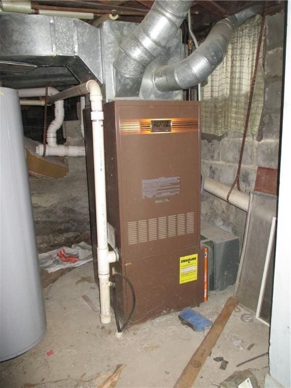 utility room featuring water heater