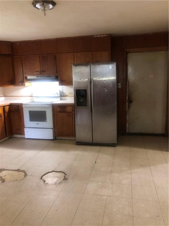 15 8th St, Oneonta-City, NY 13820 - kitchen with stainless steel fridge with ice dispenser, white electric stove, light countertops, and brown cabinets