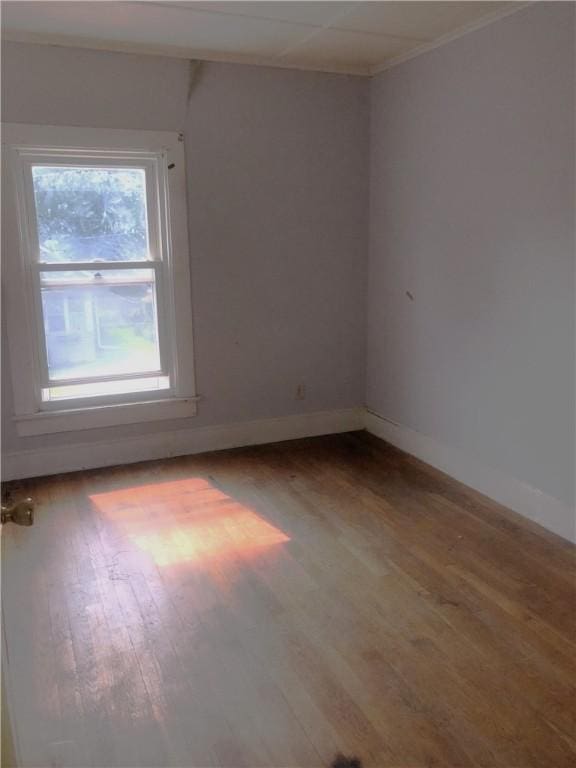15 8th St, Oneonta-City, NY 13820 - empty room featuring wood finished floors, baseboards, and crown molding