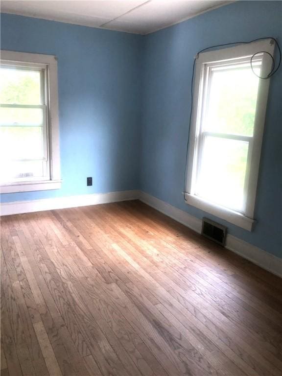 15 8th St, Oneonta-City, NY 13820 - empty room featuring wood finished floors and baseboards
