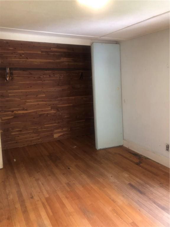 15 8th St, Oneonta-City, NY 13820 - unfurnished bedroom featuring wood finished floors and a closet