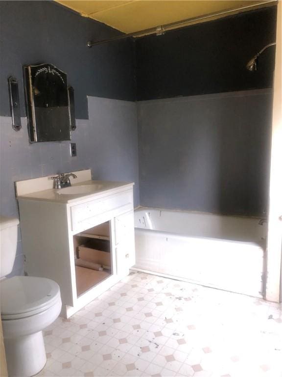 15 8th St, Oneonta-City, NY 13820 - bathroom featuring toilet, vanity, a bath, and tile patterned floors