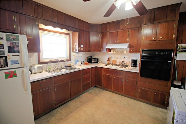 kitchen featuring white appliances, light floors, a sink, light countertops, and under cabinet range hood