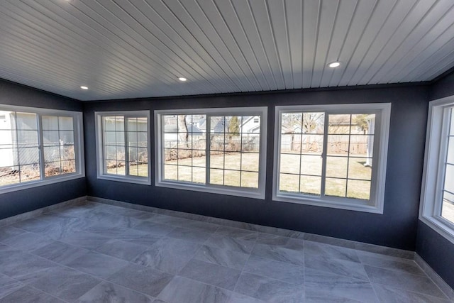 unfurnished sunroom featuring lofted ceiling and wood ceiling