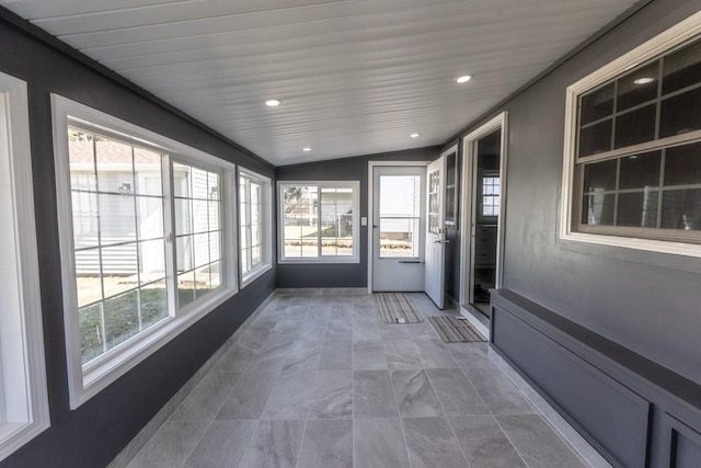 unfurnished sunroom with lofted ceiling