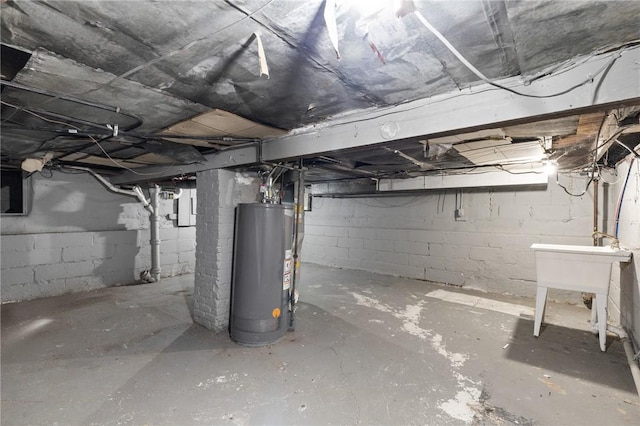 unfinished basement featuring water heater