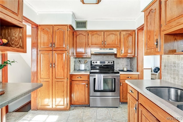 kitchen with tasteful backsplash, visible vents, crown molding, under cabinet range hood, and electric stove