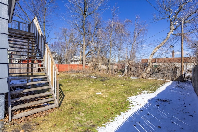 view of yard featuring stairway and a fenced backyard