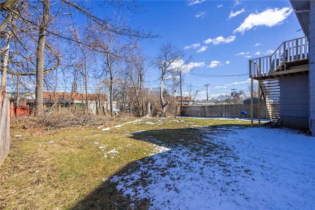 view of yard with stairs and fence