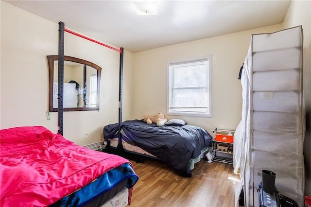 bedroom featuring wood finished floors