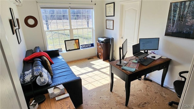 office space with visible vents and baseboards