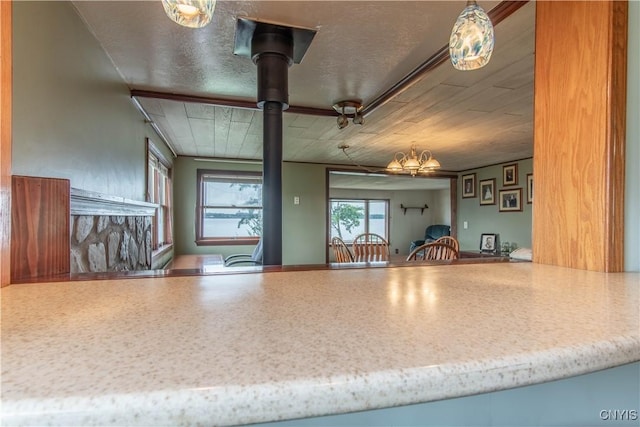 kitchen with a notable chandelier and a textured ceiling