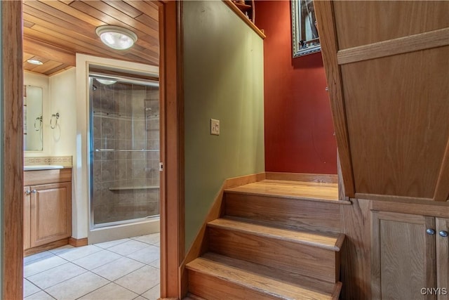 stairway with tile patterned flooring