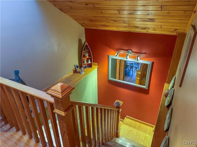 stairway with lofted ceiling and wood ceiling