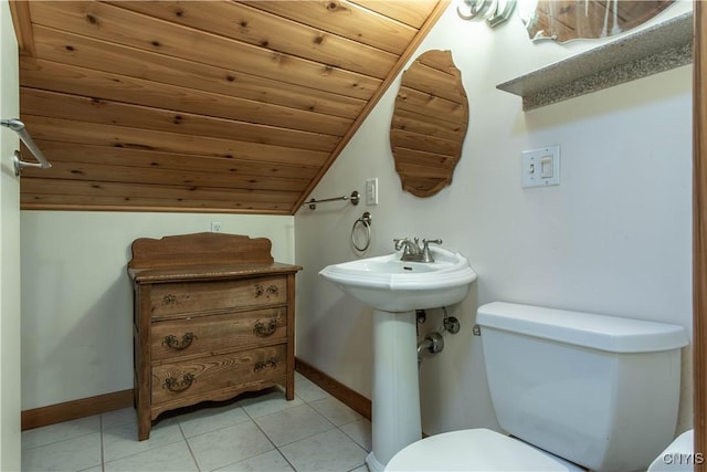 bathroom with tile patterned floors, toilet, lofted ceiling, wooden ceiling, and baseboards