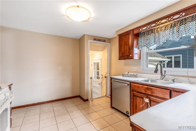 kitchen featuring a sink, light countertops, baseboards, and stainless steel dishwasher