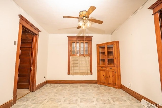 310 E German St, Herkimer, NY 13350 - unfurnished room featuring crown molding, visible vents, ceiling fan, and baseboards