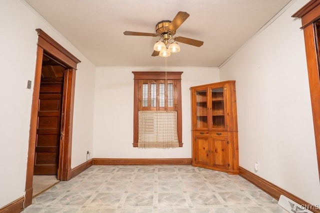 310 E German St, Herkimer, NY 13350 - unfurnished room with crown molding, visible vents, ceiling fan, and baseboards