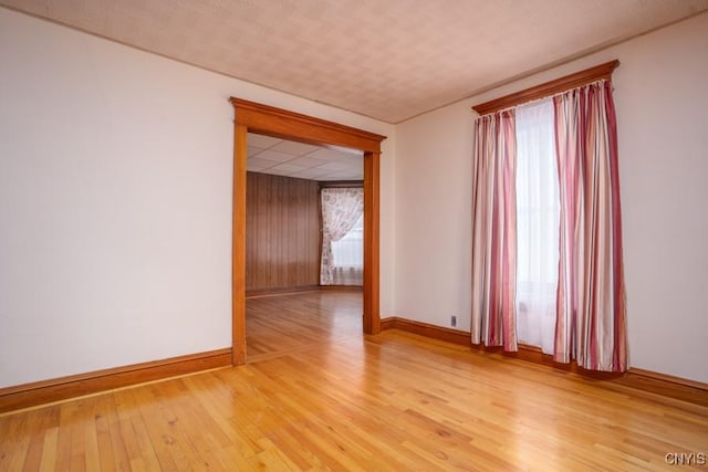 310 E German St, Herkimer, NY 13350 - spare room featuring light wood-style flooring and baseboards