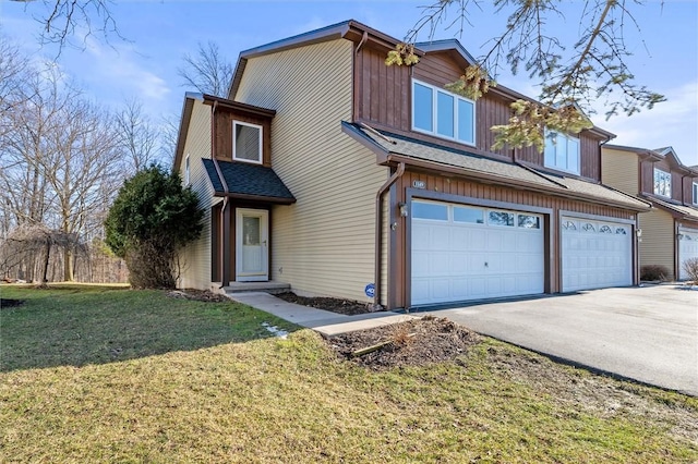 townhome / multi-family property featuring a garage, driveway, roof with shingles, and a front lawn