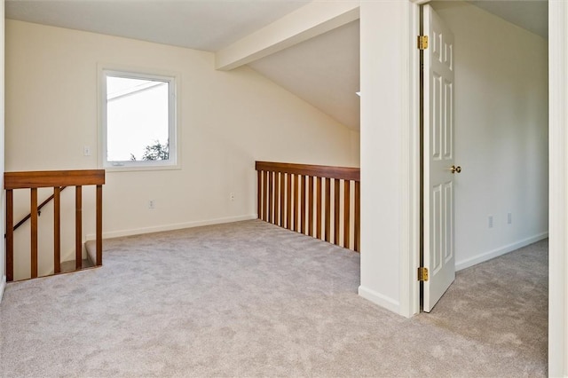 bonus room featuring baseboards, vaulted ceiling with beams, and carpet flooring