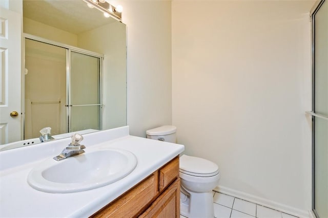 full bathroom with an enclosed shower, tile patterned floors, toilet, and vanity