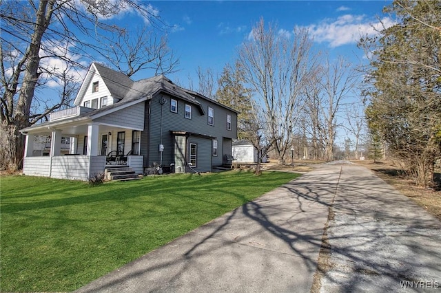 view of property exterior with covered porch and a lawn