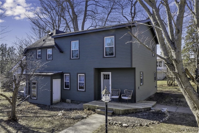 back of property featuring a deck