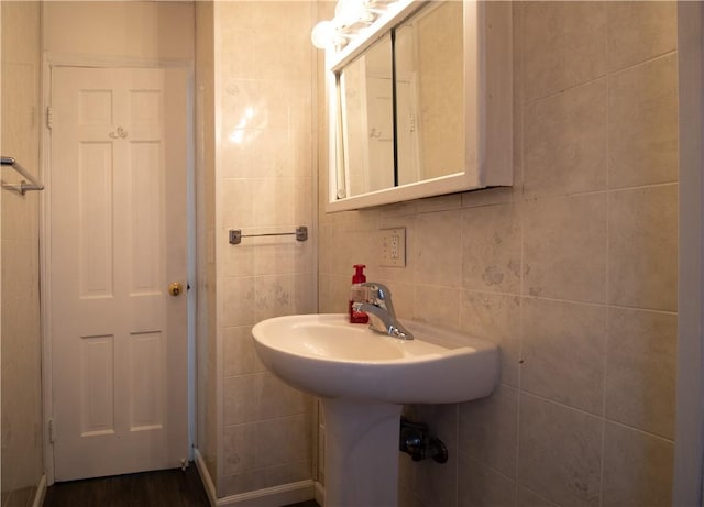 bathroom with tile walls