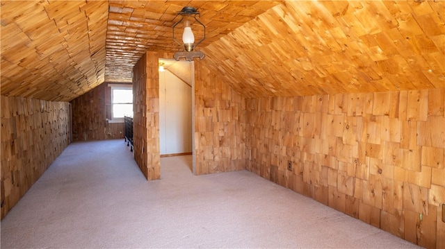 additional living space featuring carpet, lofted ceiling, wood ceiling, and wood walls