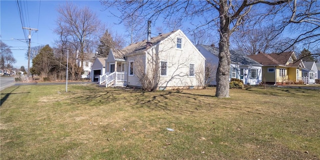 view of home's exterior with a yard