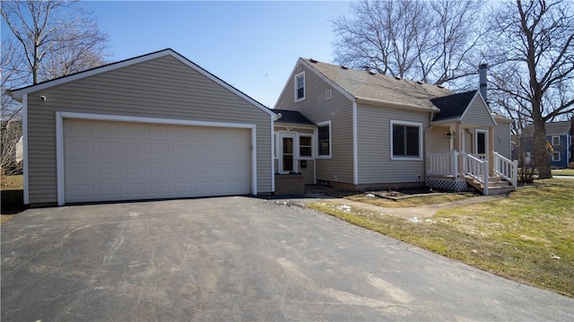 view of front of property featuring an attached garage and driveway