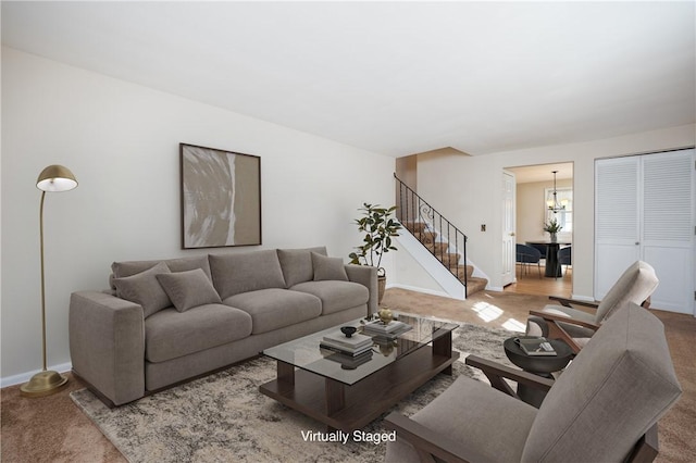 living area with stairs, an inviting chandelier, carpet, and baseboards