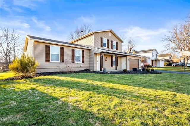 view of front of property featuring a garage and a front lawn