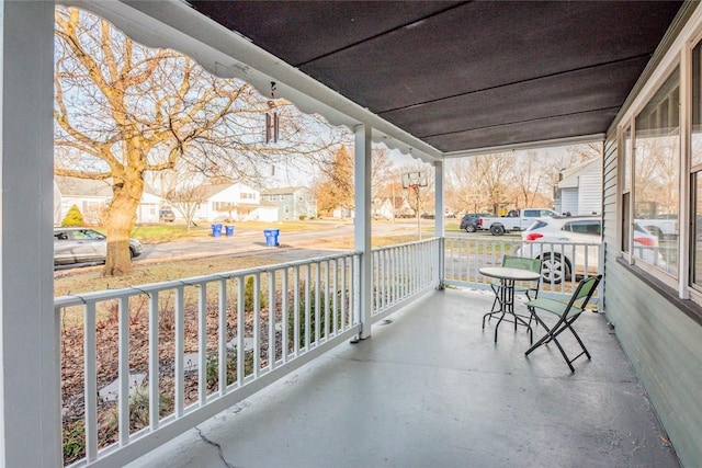 balcony featuring a residential view and a porch