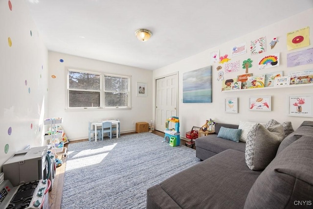 playroom with baseboards and carpet