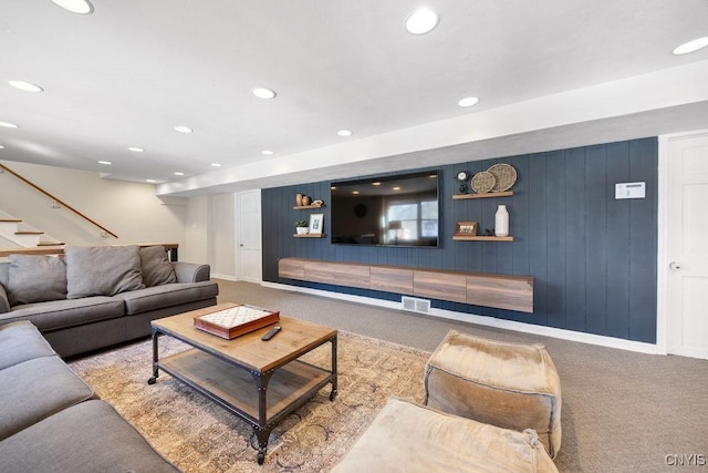 living room featuring visible vents, baseboards, carpet, stairs, and recessed lighting