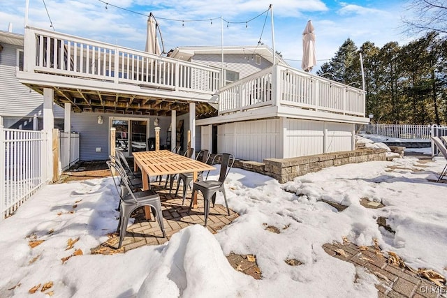 view of patio / terrace with outdoor dining area, a deck, and fence