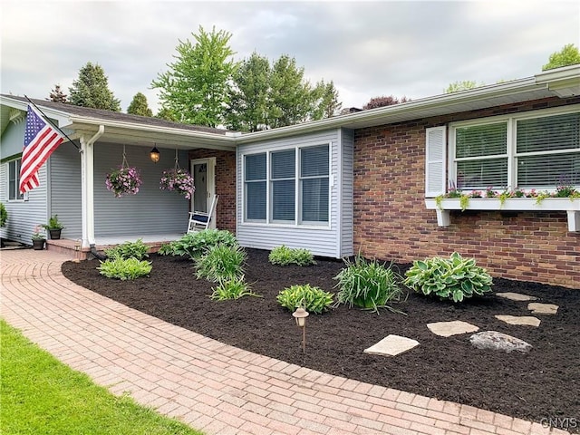 view of front of property featuring brick siding