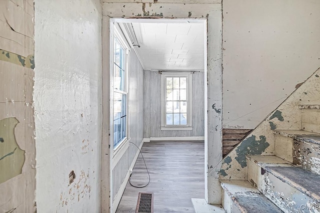 interior space with wood finished floors and visible vents