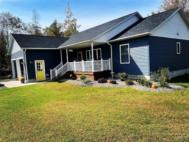 ranch-style home with covered porch, an attached garage, and a front lawn