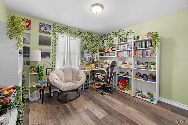 recreation room with baseboards and wood finished floors