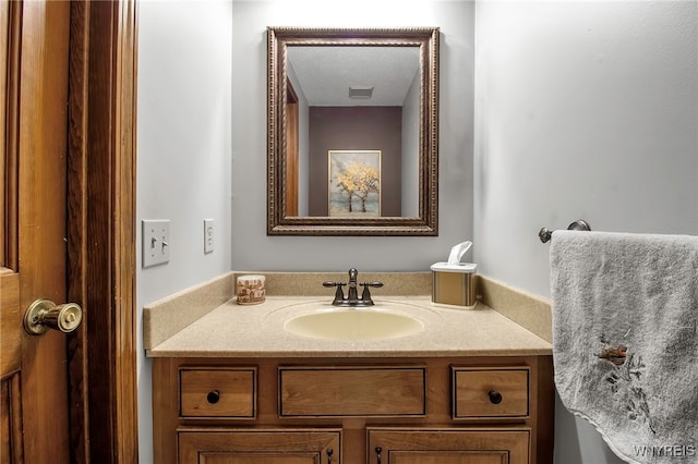 bathroom with visible vents and vanity