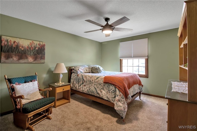 bedroom featuring carpet flooring, ceiling fan, a textured ceiling, and baseboards