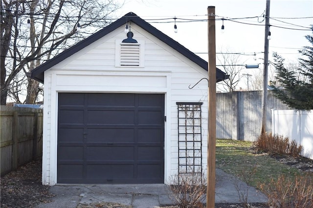 detached garage with fence