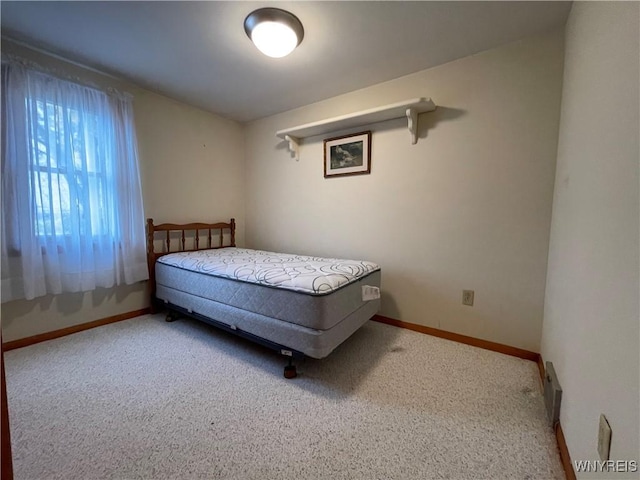 bedroom with baseboards and carpet floors