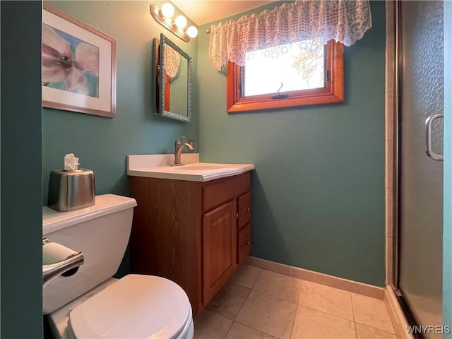 bathroom with tile patterned flooring, baseboards, toilet, an enclosed shower, and vanity