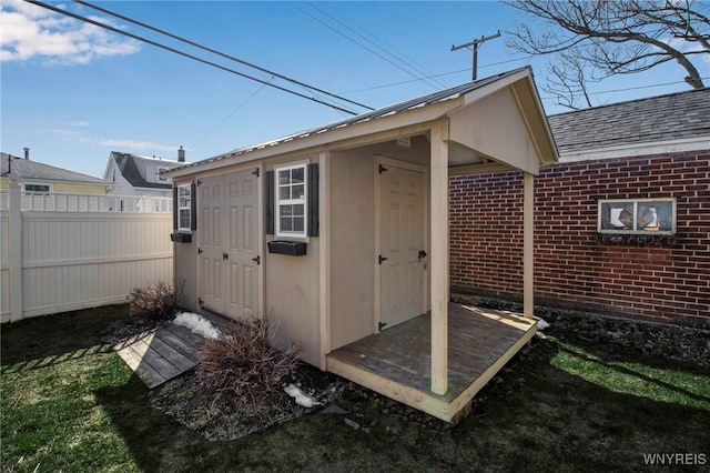 view of shed with fence