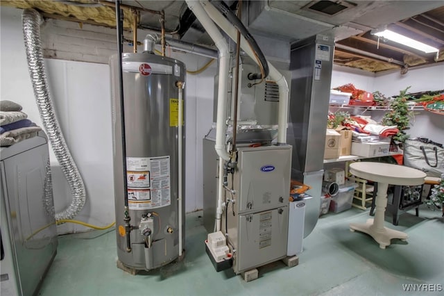 utility room with gas water heater, visible vents, and washer / dryer